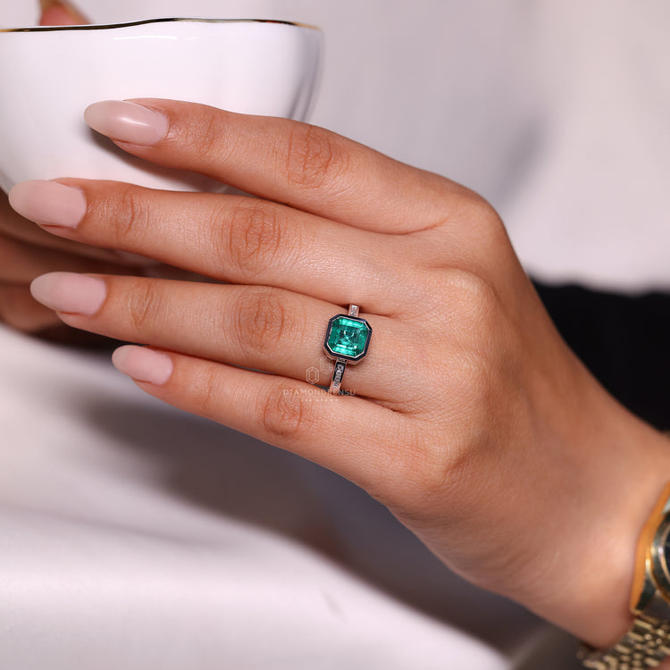 Asscher cut ring emerald bezel channel diamond setting.
