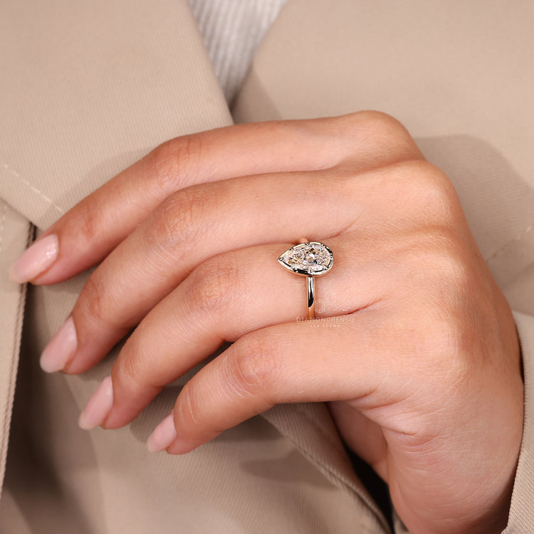 Pear cut ring vintage solitaire prong setting.
