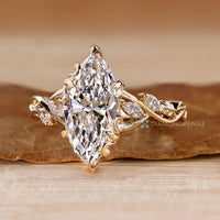 Marquise diamond ring with flower bud style setting.