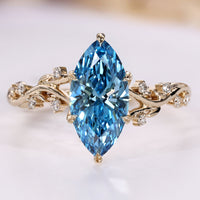 Blue diamond marquise ring with tulip basket setting.