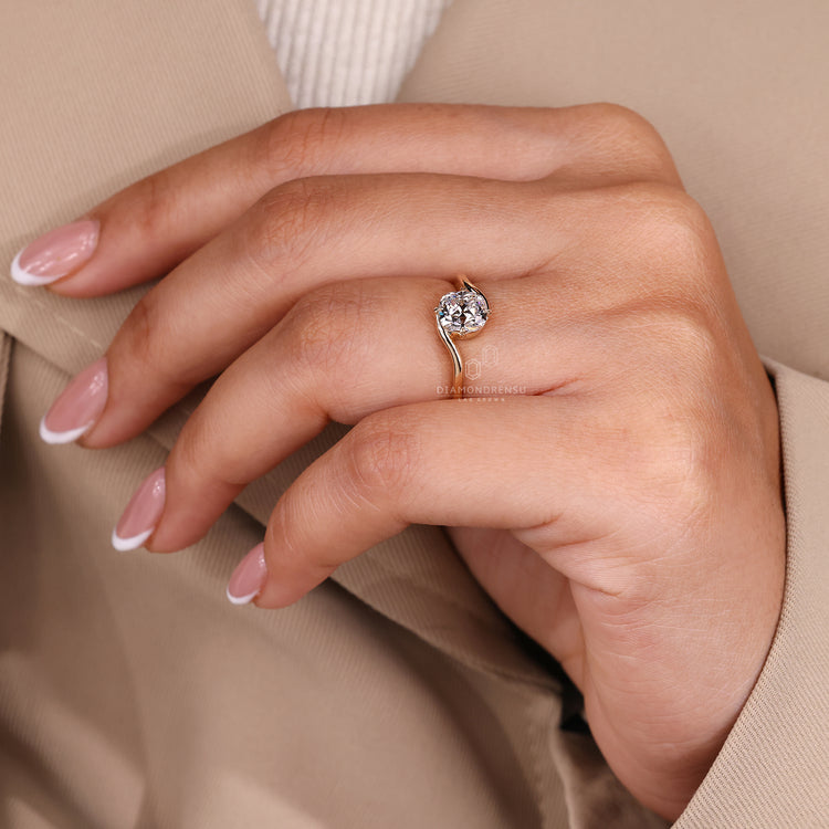 Bypass setting cushion old European cut diamond ring.