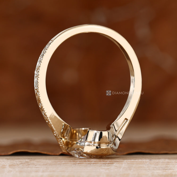 Oval cut diamond ring with Art Deco inspired style.