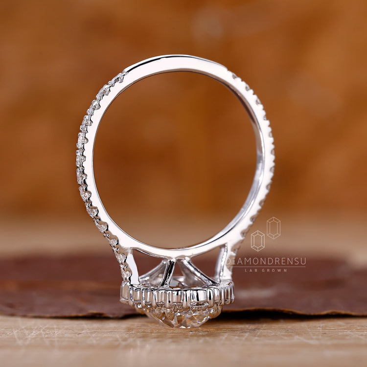 Cushion Old European Cut Ring with round diamonds.
