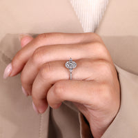 Oval cut diamond ring with four claw prong setting.
