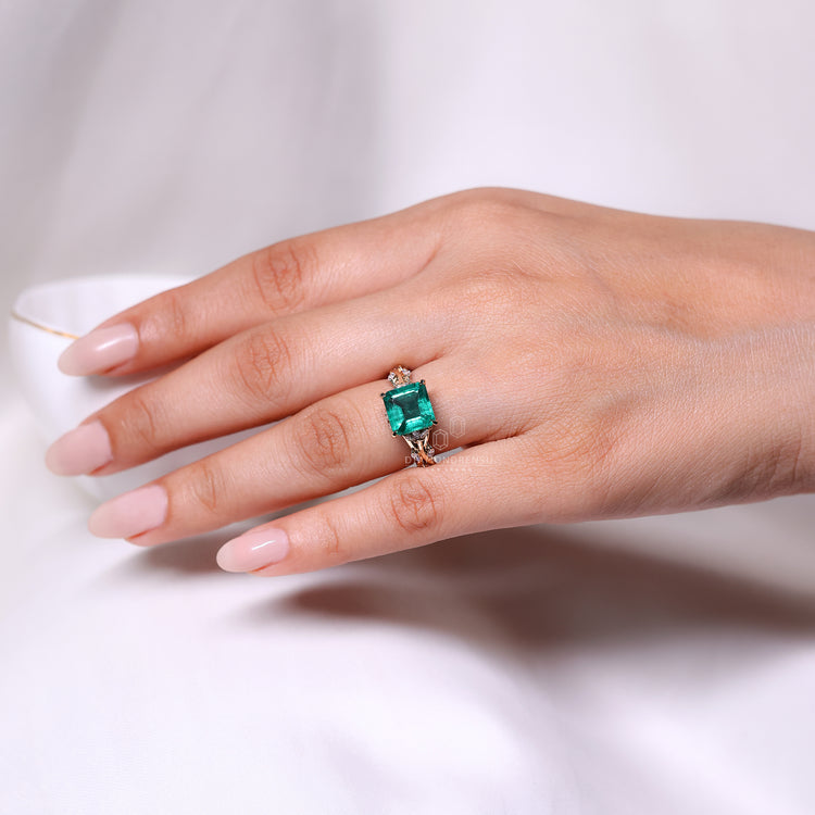 Emerald gemstone ring marquise stones prong cluster set.
