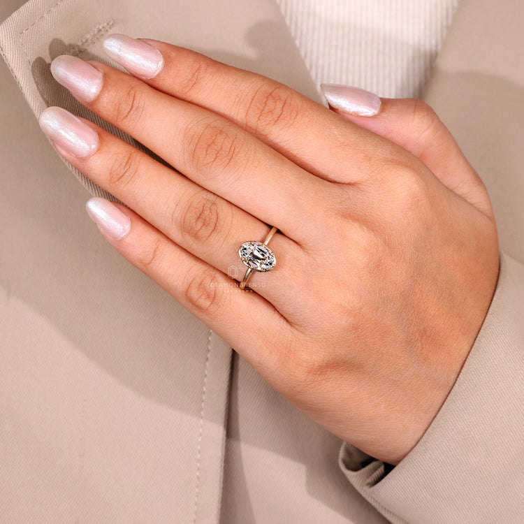 Solitaire engagement ring with eight claw prong setting.
