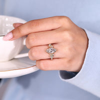 Nature inspired marquise diamond ring pave round stone.