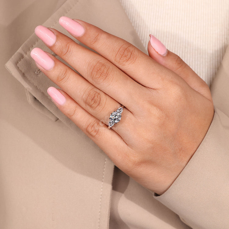Round cut diamond ring IGI certified three stone.
