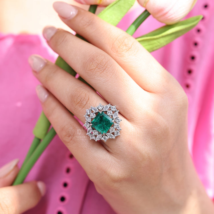 Emerald gemstone ring marquise stones prong cluster set.

