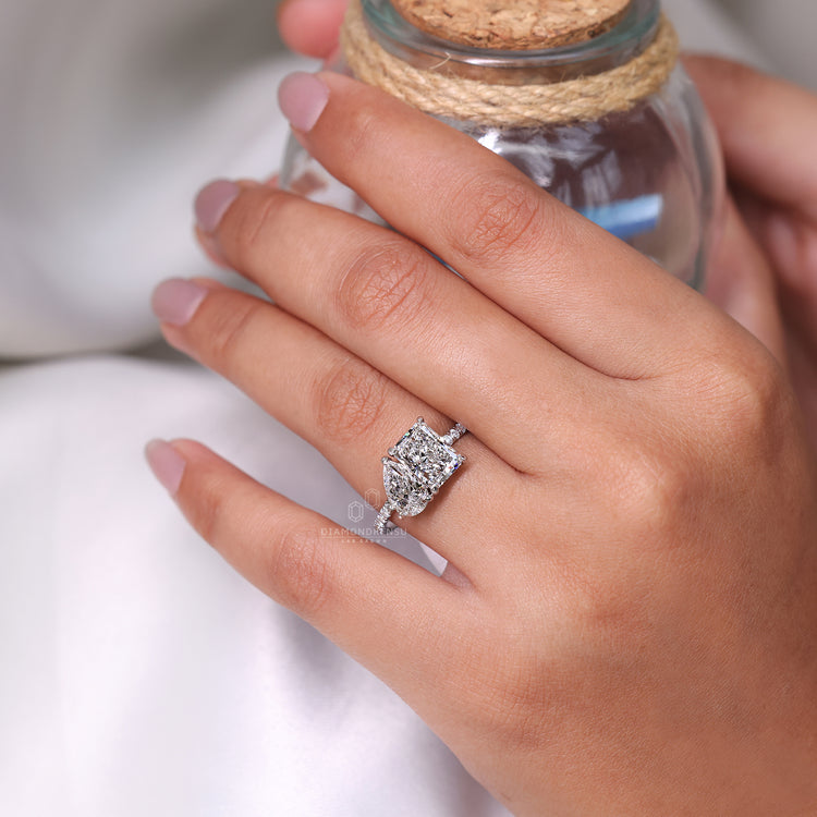 Toi et moi ring pear radiant claw prong setting.
