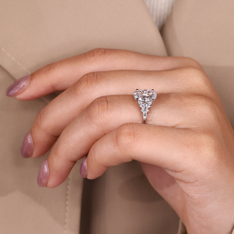Oval diamond ring with tapered shank style.
