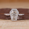 Coffin cut diamond ring halo bezel setting style.