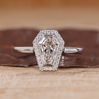 Coffin cut diamond ring halo bezel setting style.