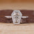 Coffin cut diamond ring halo bezel setting style.