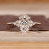 Coffin cut diamond ring round side stones set.