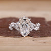 Coffin cut diamond ring marquise side stones set.