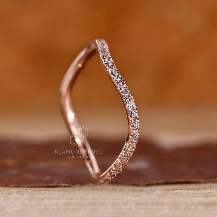 Round cut band ocean wave half eternity design.

