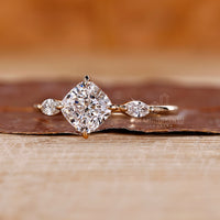 Lab grown cushion diamond ring marquise three stone style.
