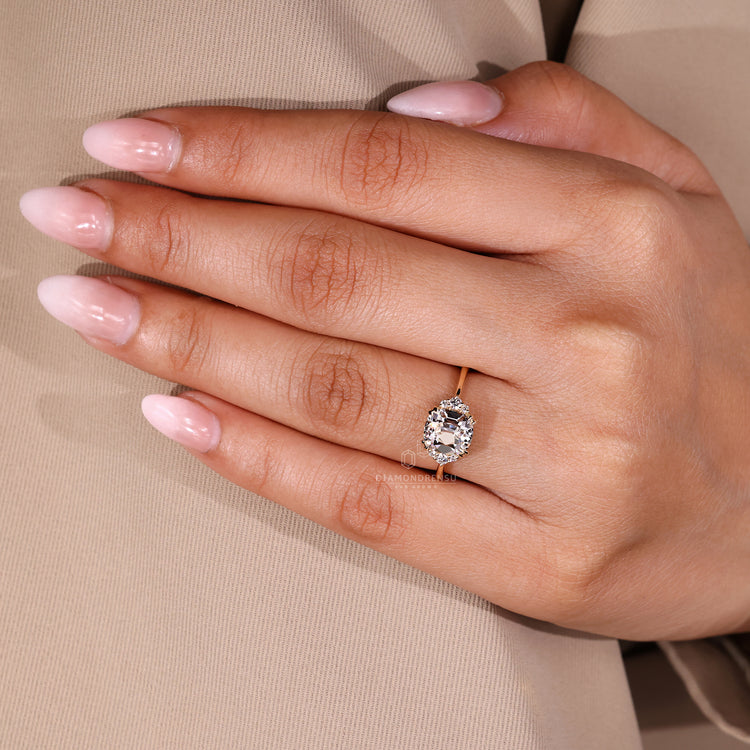 Round cut side stones Cushion Old European Cut seven stone ring.
