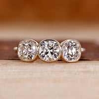 Cushion Old European Cut Ring three stone style design.
