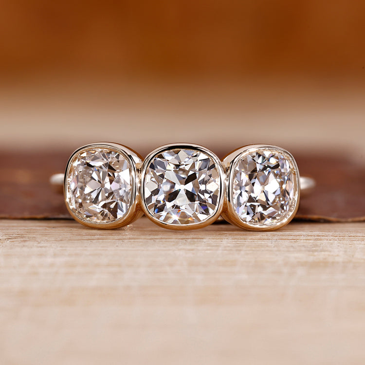 Cushion Old European Cut Ring three stone style design.
