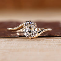 Solitaire diamond ring with cushion old European cut centre.