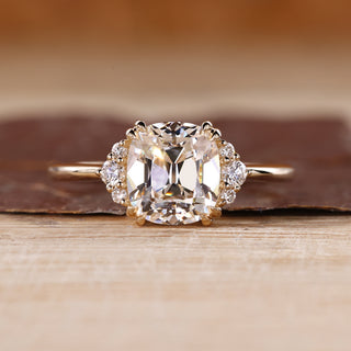 Cushion Old European Cut Ring with round cut side stones.
