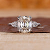 Cushion Old European Cut Ring with two pear side stones.
