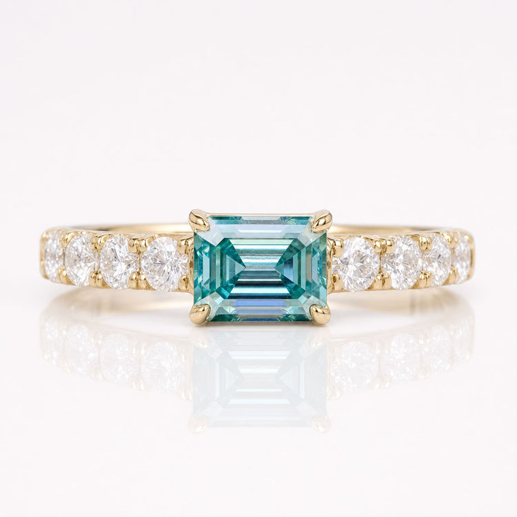 0.82 TCW Cyan Blue Emerald Moissanite Pavé Set East To West Ring