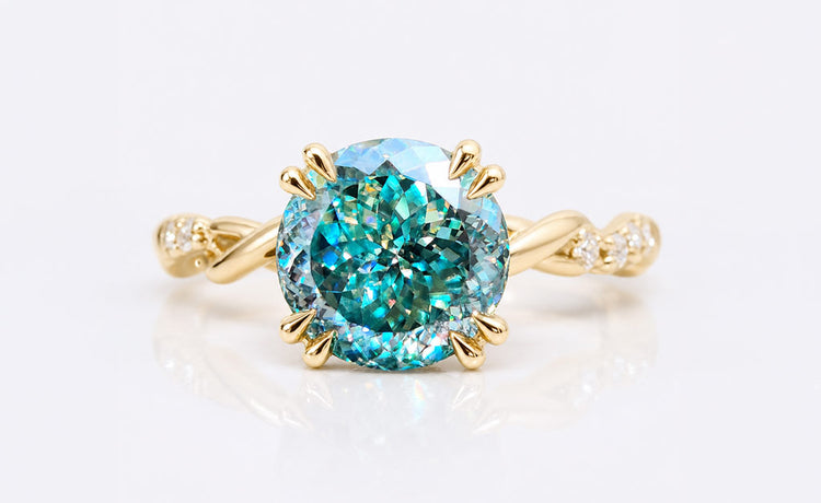 Antique cut moissanite ring with a pave set band in solid gold