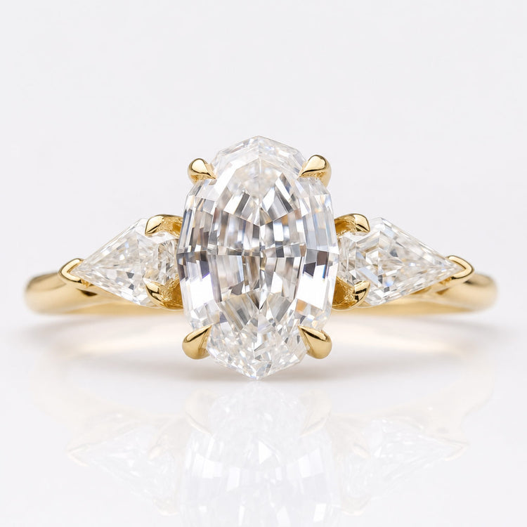 Antique cut moissanite three stone ring with a centre stone and two side stones