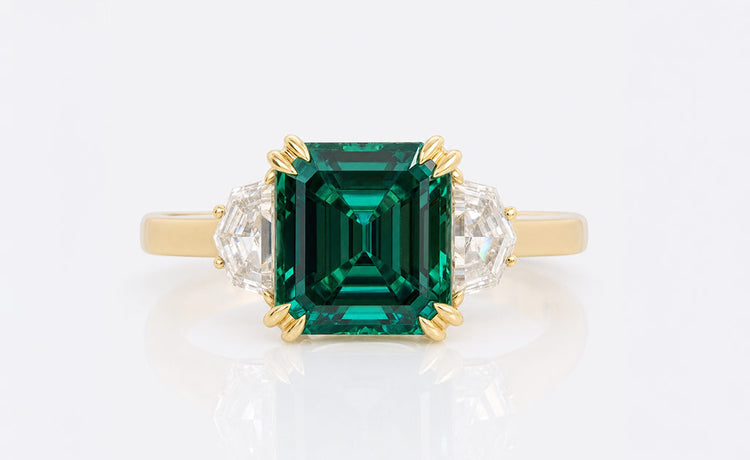 Asscher cut coloured moissanite ring with a tinted centre stone in solid gold