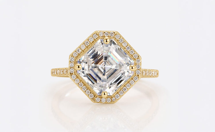 Asscher cut moissanite halo ring framed by pave set stones