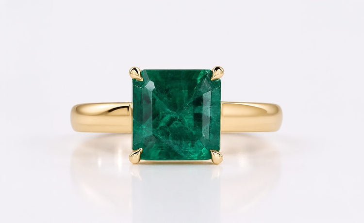 Asscher cut lab grown diamond solitaire ring on a plain solid gold band