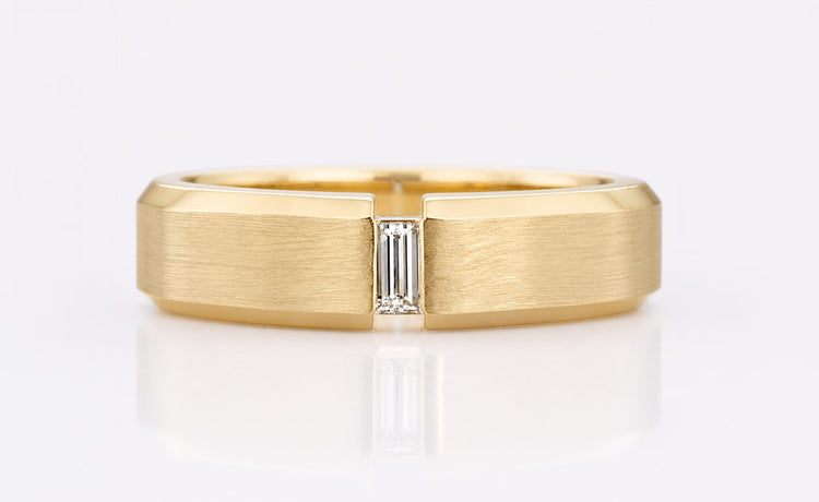 Baguette cut lab grown diamond solitaire ring on a plain solid gold band