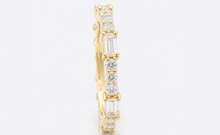 Baguette cut moissanite wedding ring with channel set stones in solid gold