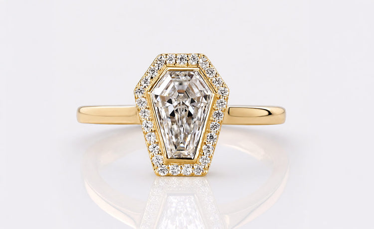 Bezel set engagement ring with the centre stone framed by a smooth metal rim