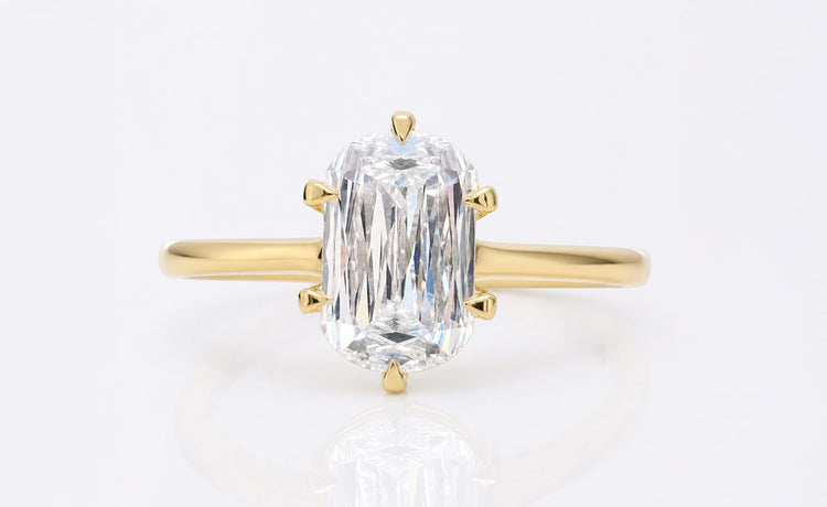 Antique style cushion cut moissanite ring with milgrain detailing in solid gold