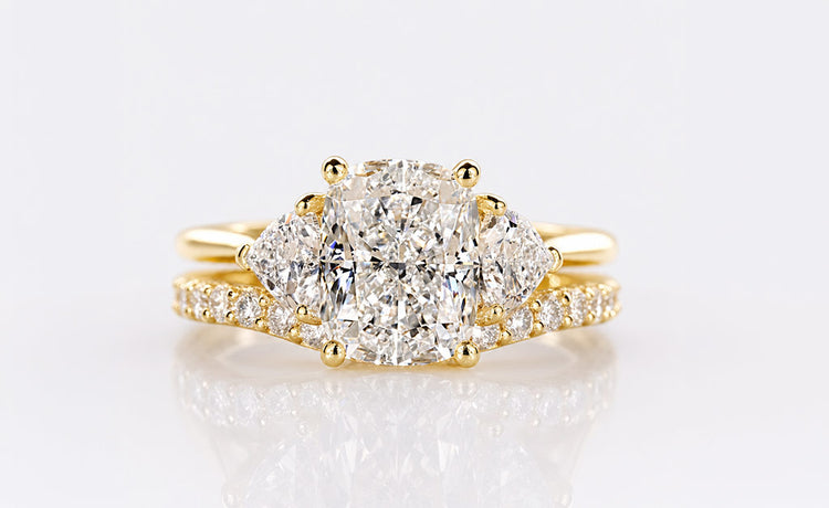 Cushion cut lab grown diamond bridal set with a matching engagement ring and band