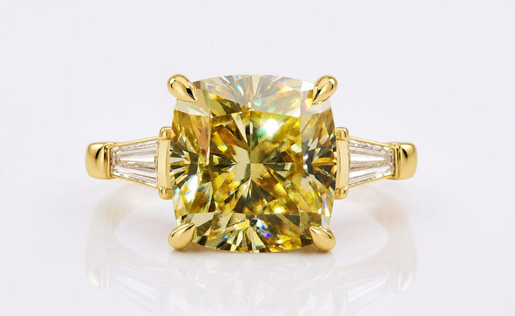 Cushion cut coloured moissanite ring with a tinted centre stone in solid gold