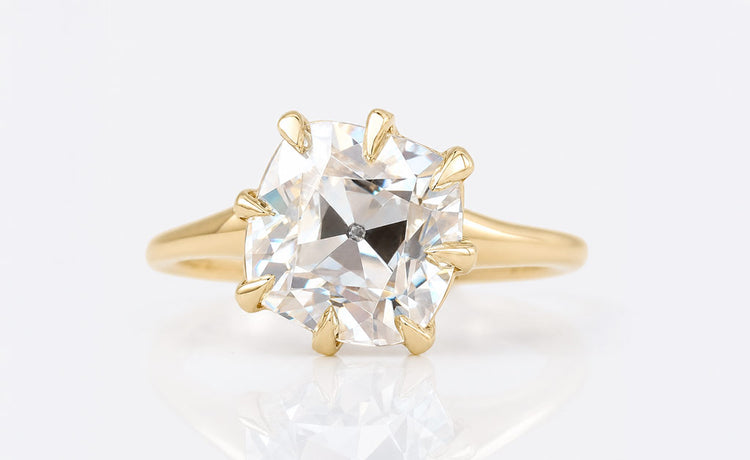Cushion cut moissanite stud earrings in solid gold settings