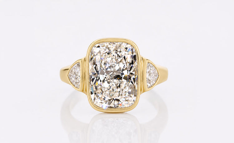 Cushion cut lab grown diamond three stone ring with two side stones