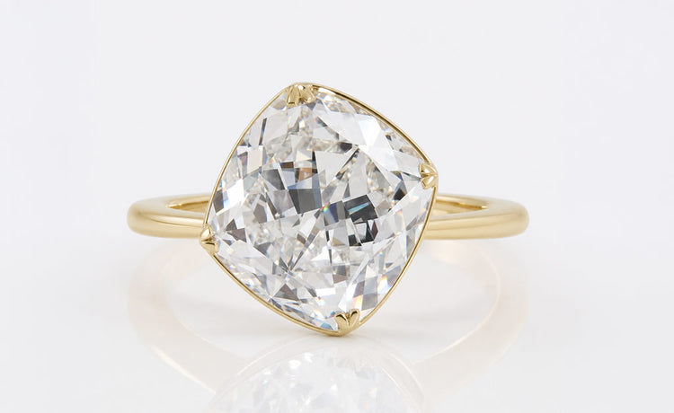 Loose cushion divine cut moissanite with a crushed ice faceting pattern