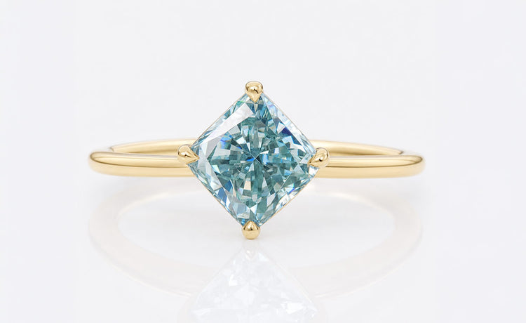 Cyan blue moissanite stone with a vivid teal blue tone