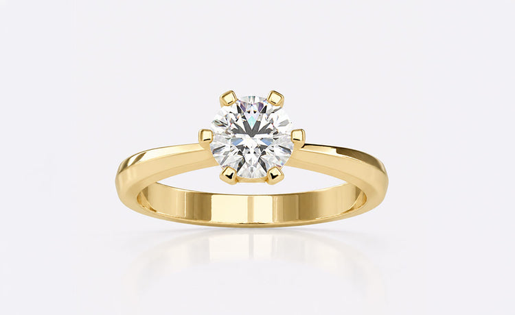 Designer engagement ring with a distinctive setting in solid gold