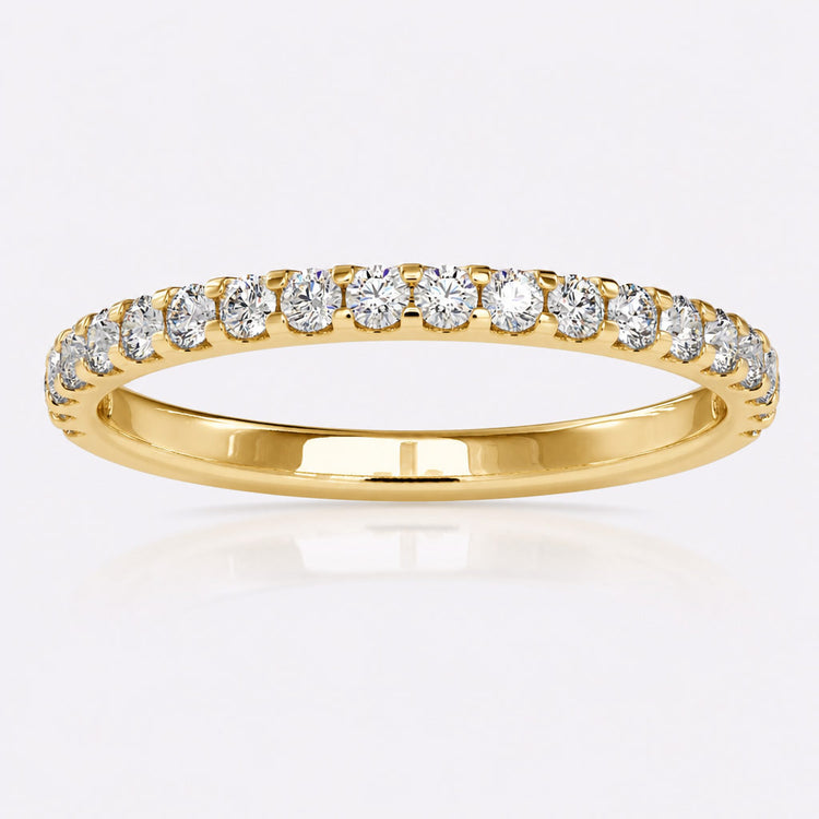 Designer wedding band with sculpted detailing in solid gold