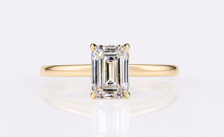 Emerald cut lab grown diamond engagement ring in a solid gold setting