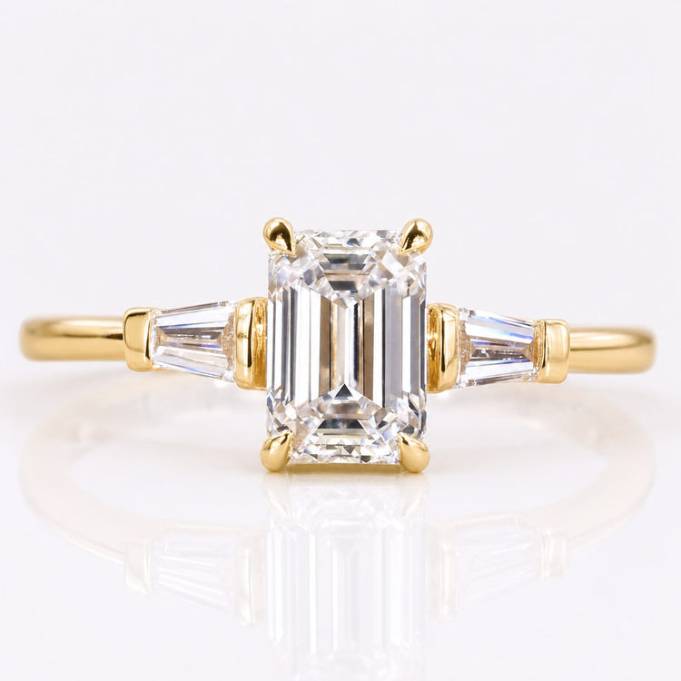 Emerald cut lab grown diamond three stone ring with two tapered side stones