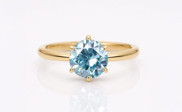 Green moissanite stone with a soft mint green hue
