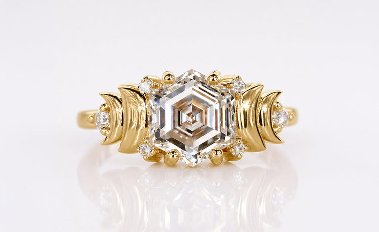 Lozenge and hexagon cut diamond rings with geometric step cut stones